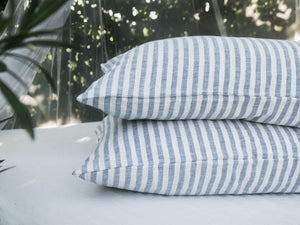 Lagodie Photo - Striped Linen Pillowcases on a bed outdoors