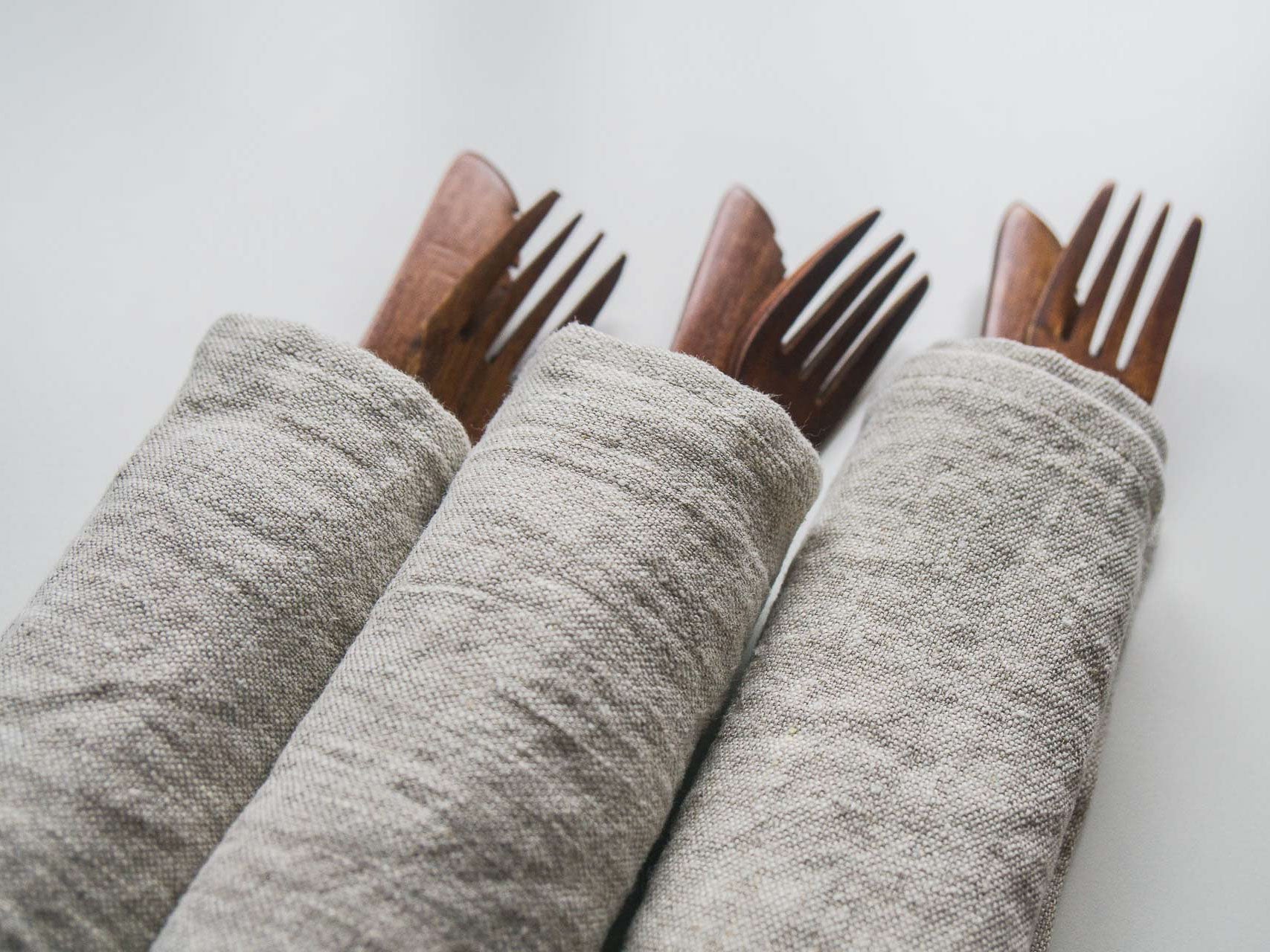 Wooden Cutlery rolled in Linen Napkins  Edit alt text